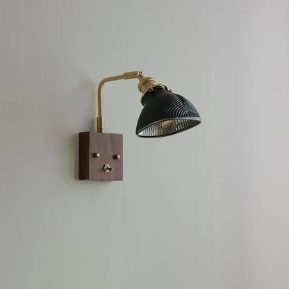 Black ceramic lamp with brass accents and wooden base complements antique brass and walnut clear glass wall lights stair fixture decorbites clear glass decor