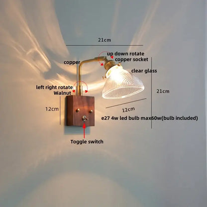 A rustic copper finished arm wall light with clear glass shade on walnut wood base for decorbites clear glass wall lights