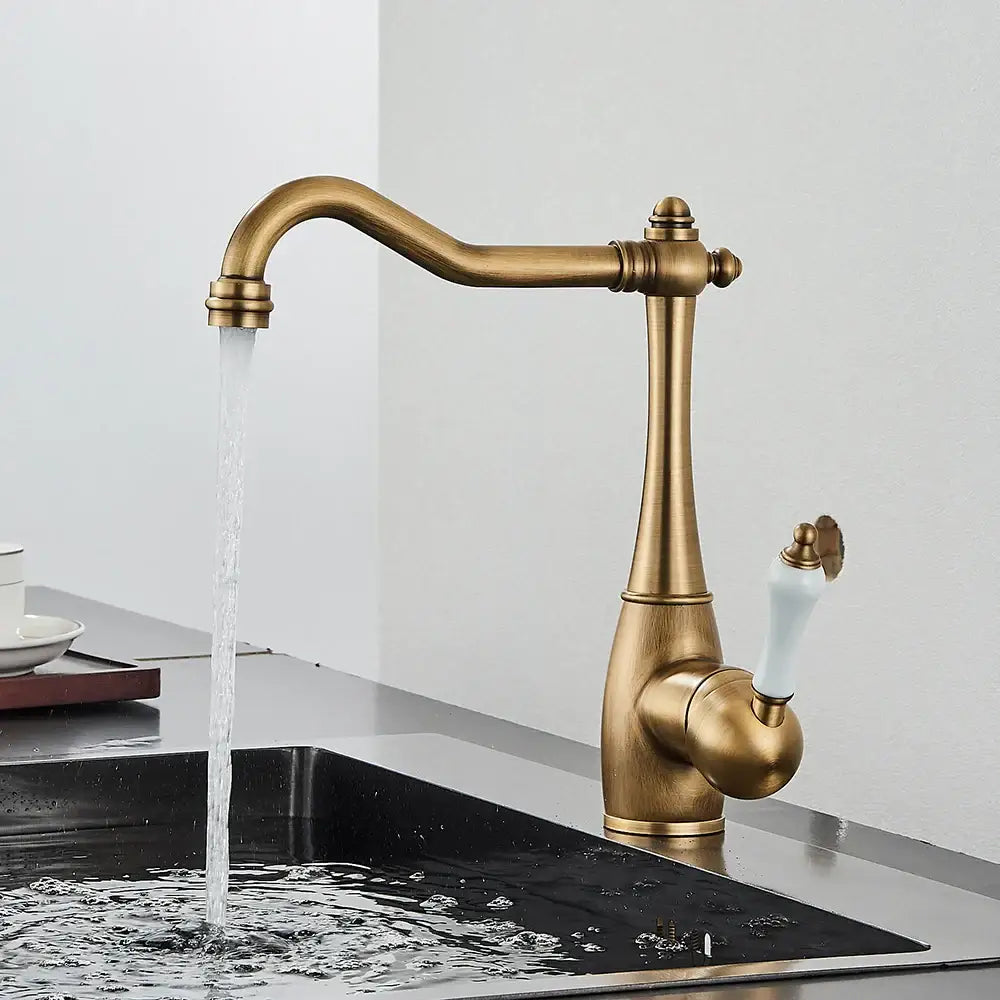 Antique brass and white ceramic basin waterfall faucet with a brass basin waterfall kitchen tap mixer design