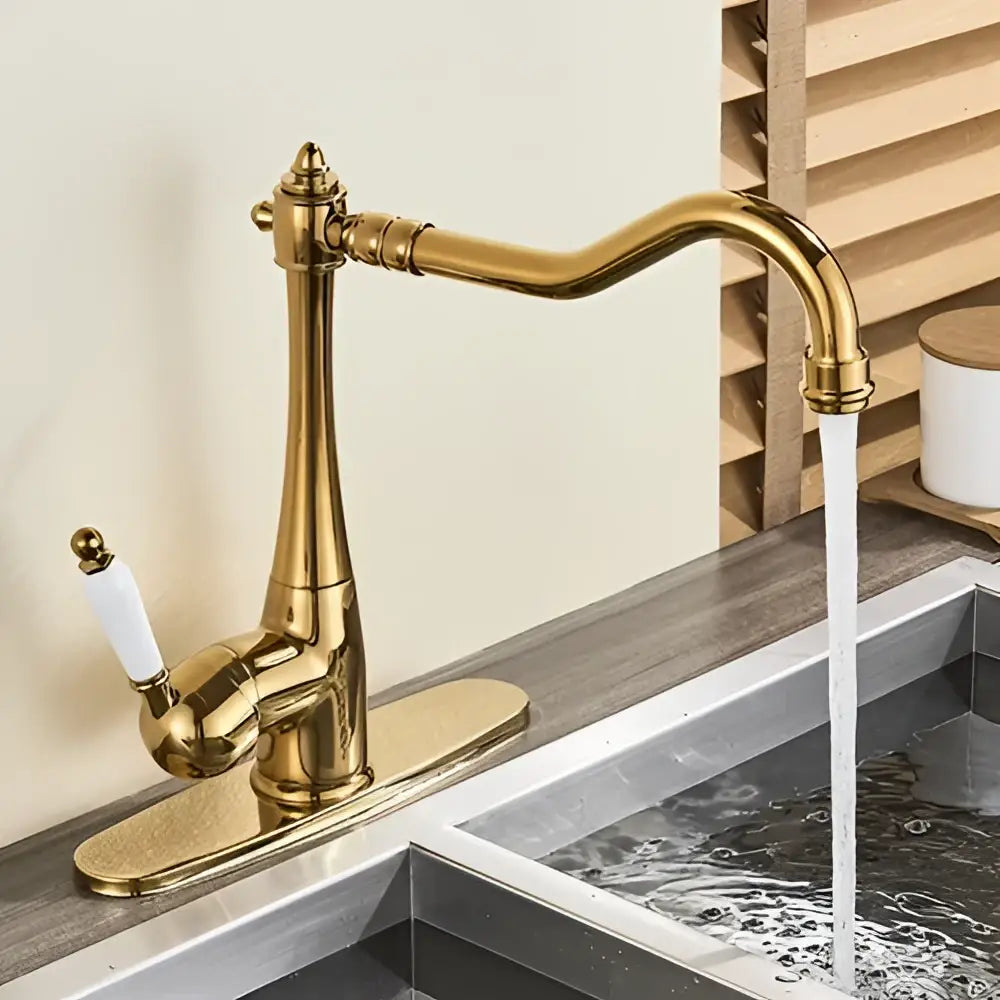 Antique brass basin waterfall faucet with gold finish curved spout and white ceramic handle for kitchen use