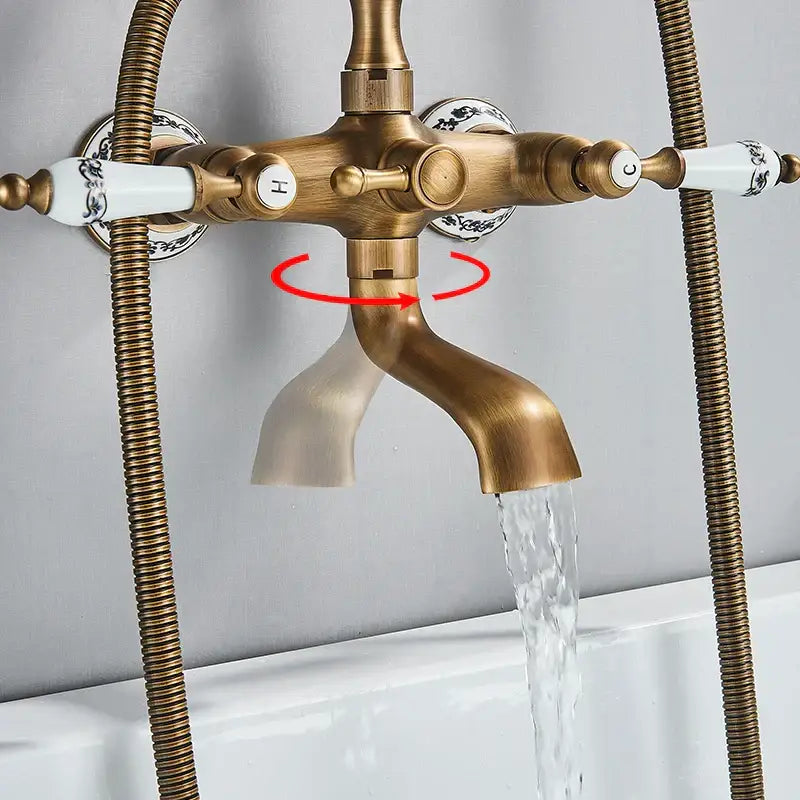 Antique brass and white ceramic bathtub shower faucet set with black floral handles and rotating spout for bathroom use