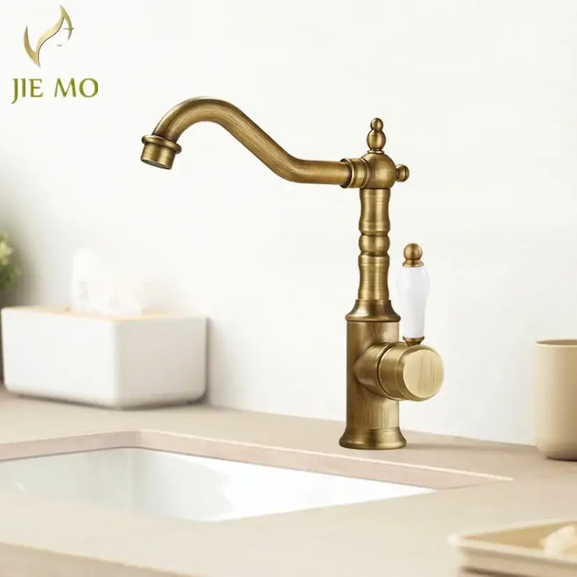 Antique brass and white ceramic gold luxury kitchen faucet with ornate vintage design from decorbites gold luxury collection