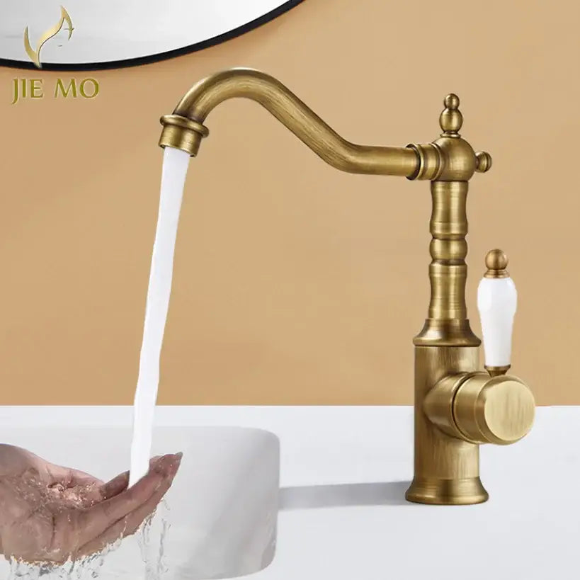 Antique brass and white ceramic decorbites gold luxury kitchen faucet with ornate vintage-inspired design