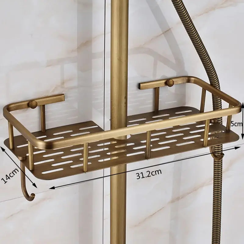 Brass-colored metal shower caddy with perforated design and curved handles in an antique brass shower faucet set