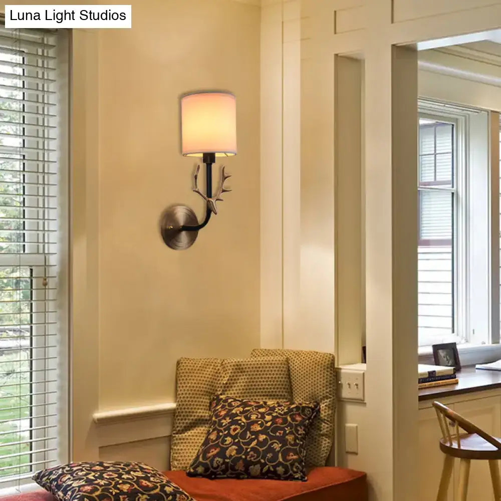 Antique brass antler wall sconce with stylish design fabric shade and brushed metal finish for bedroom lighting