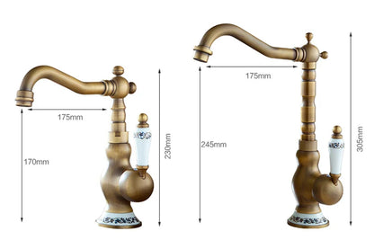 Antique brass basin faucet with curved spout and decorative ceramic handle featuring blue floral patterns