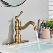 Antique brass brass basin faucet with a single handle and swivel curved spout for bathroom use by decorbites