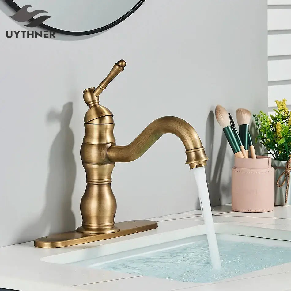 Antique brass brass basin faucet with a single handle and swivel curved spout for bathroom use by decorbites