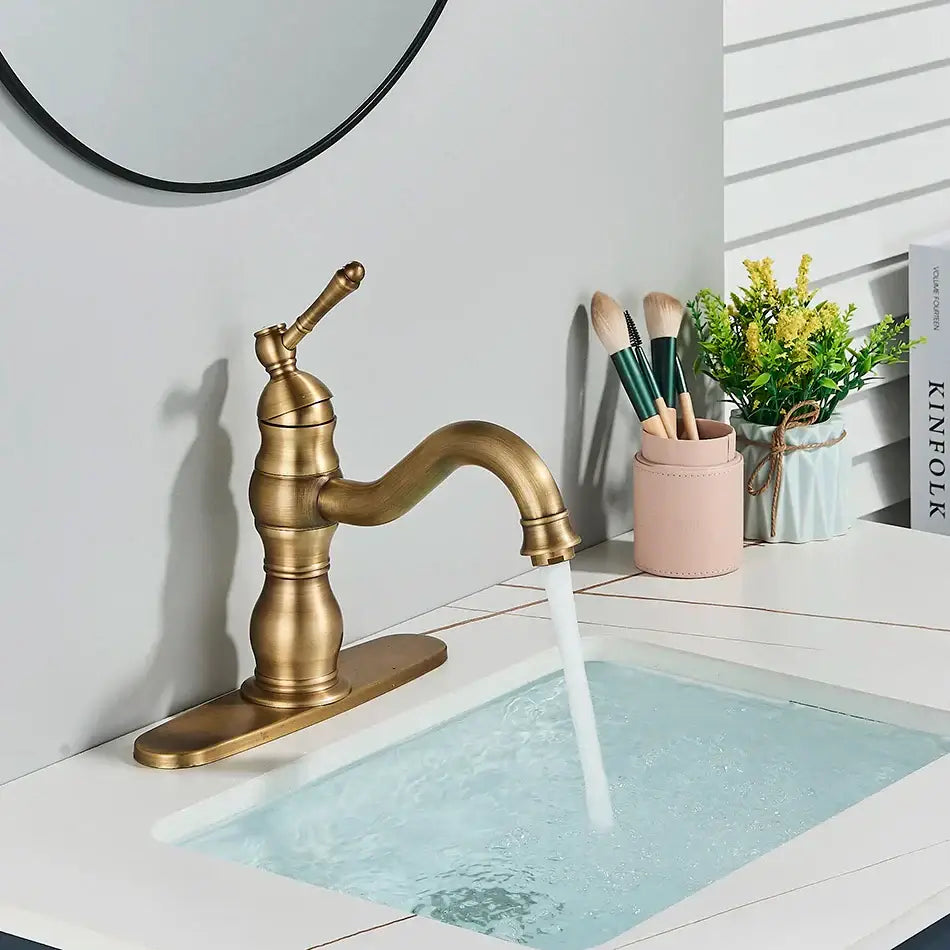 Antique brass basin faucet with single handle swivel spout and decorative base for bathroom use decorbites brass basin faucet