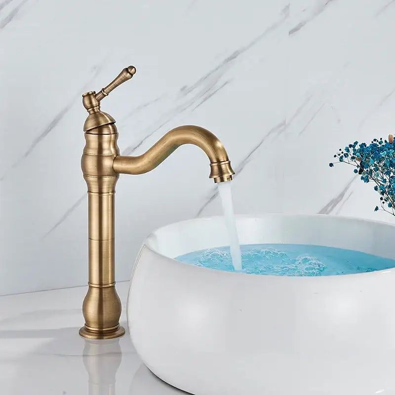 Antique brass basin faucet with single handle swivel spout featuring ornate detailing for bathroom use by decorbites brass basin