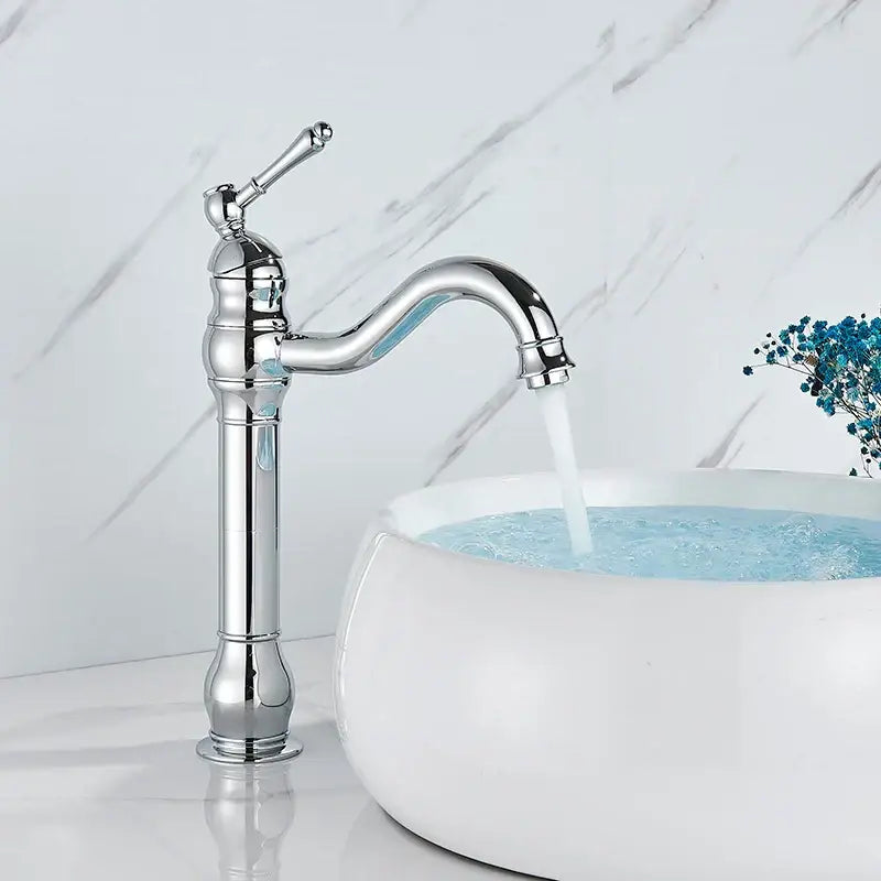 Chrome finished ornate single-handle basin faucet with curved spout and decorative base for decorbites brass basin faucet