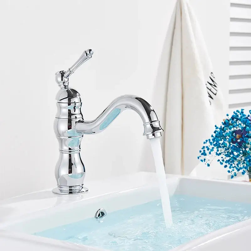 Chrome-finished single-handle bathroom basin faucet with curved spout and decorative ridged base suitable for brass basin faucet decorbites