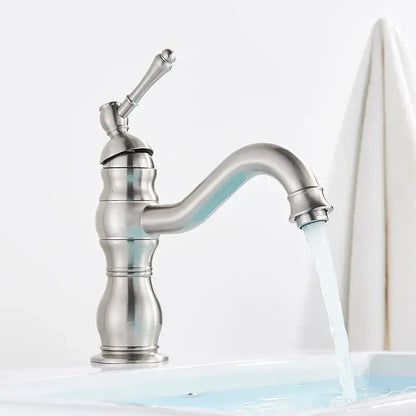 A sleek brushed nickel basin faucet with single handle curved spout and ornate detailing for bathroom decorbites brass basin