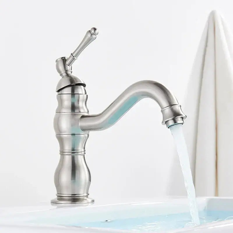 A sleek brushed nickel basin faucet with single handle curved spout and ornate detailing for bathroom decorbites brass basin