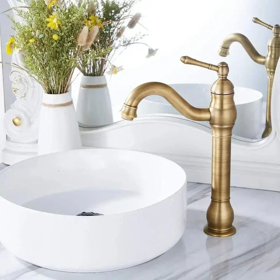 Antique brass basin faucet with curved spout and ornate detailing decorbites brass basin faucet for bathroom use