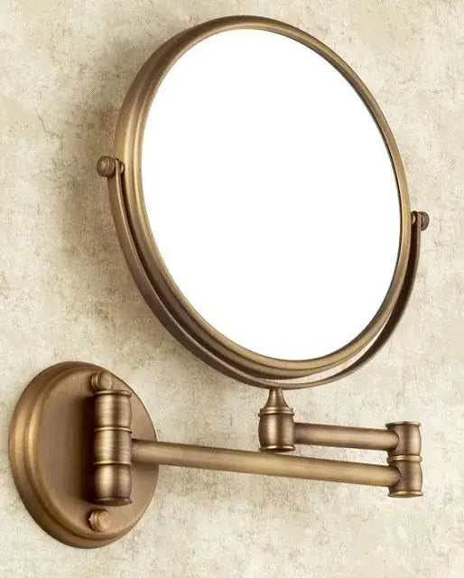 Brass antique bath hardware set featuring a wall-mounted magnifying mirror with telescoping arm and circular frame
