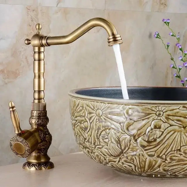 Antique brass bath hardware single-handle kitchen faucet with ornate detailing and a curved spout by decorbites brass antique