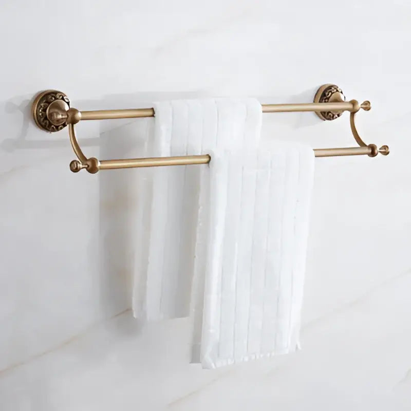 Antique brass bath hardware double towel rack with ornate wall-mounted ends and central horizontal bar decorbites brass antique