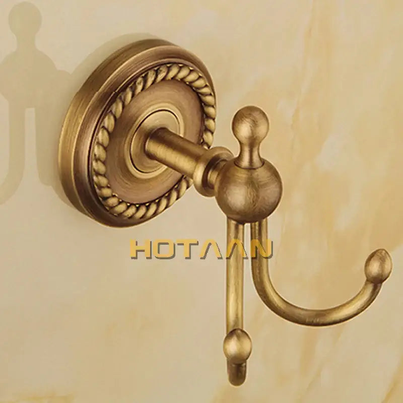 Antique brass double hook towel rack with rope textured circular backplate and spherical finials brass bathroom accessories set
