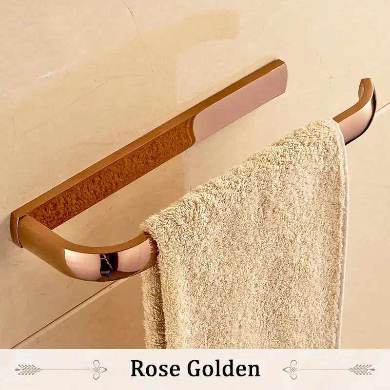 Rose gold towel rack with sleek modern design and brushed metal finish from decorbites brass bathroom accessories set