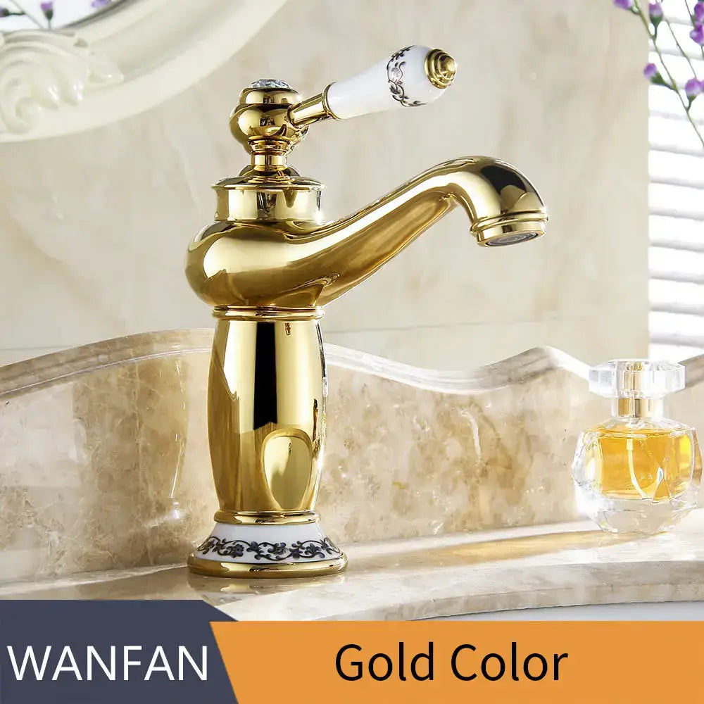 Antique brass bathroom basin water mixer with gold-colored brass body and white ceramic handle featuring black ornate detailing