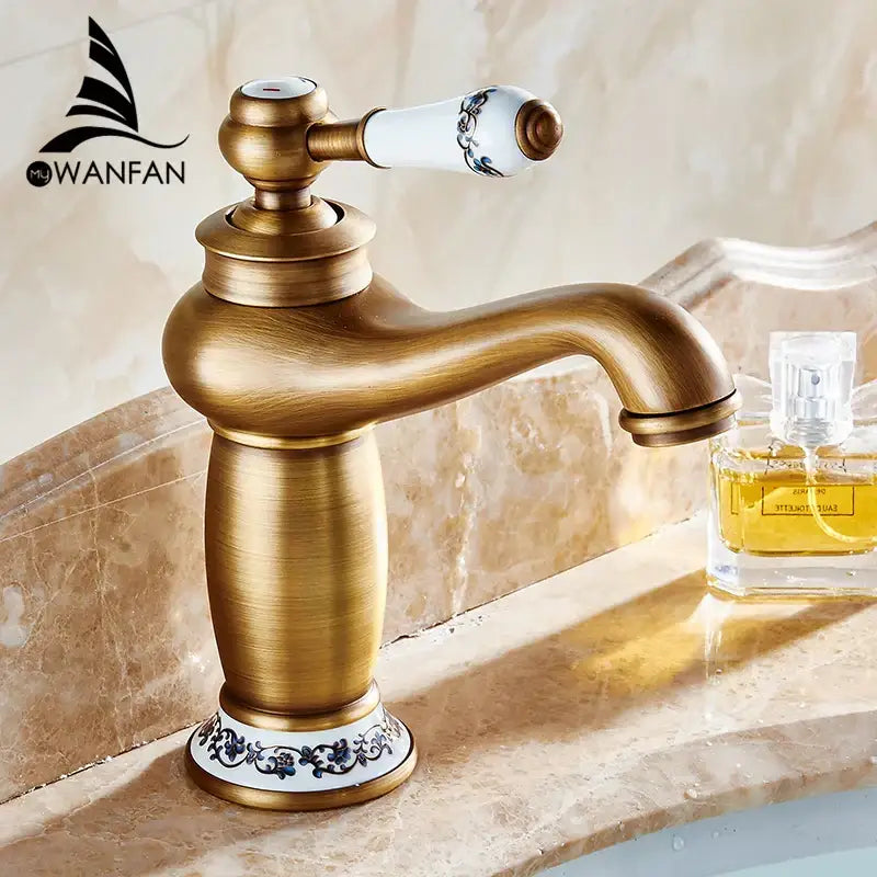 Antique brass bathroom basin water mixer with white ceramic handle and blue floral decorbites brass bathroom design