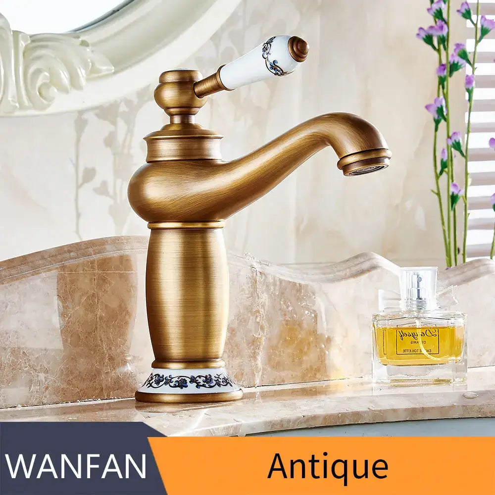 Antique brass bathroom basin water mixer with white ceramic handle featuring blue floral decorbites brass bathroom design
