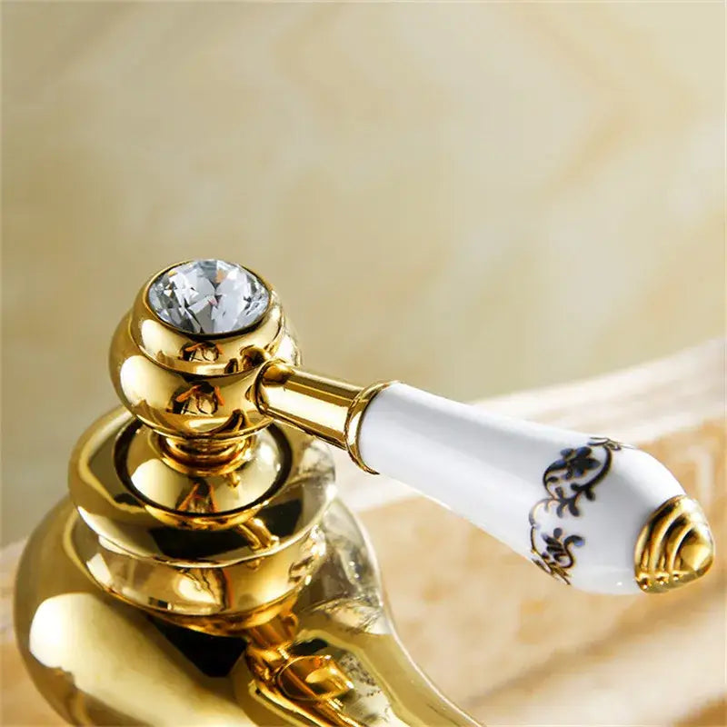 Antique brass bathroom basin water mixer with gold finish and blue floral ceramic handle by decorbites brass bathroom