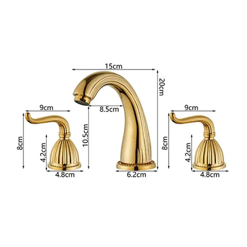 Antique brass bathroom faucet set with gold-colored ornate three-piece design and fluted handles with curved spout