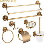Antique brass bathroom set by decorbites featuring ornate circular mounts and a white ceramic brush cup with gold trim