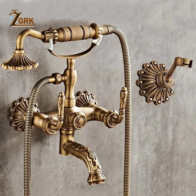 Antique brass bathtub shower set with vintage-style wall-mounted faucet, ornate fluted spouts, and decorative escutcheons