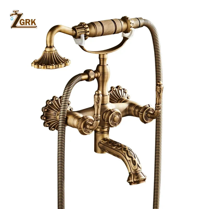 Antique brass bathtub shower set with vintage-style faucet, ornate shell detailing, and handheld showerhead