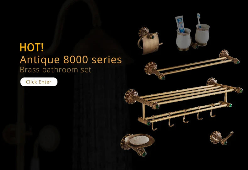 Antique brass bathtub shower set with ornate shell-shaped ends and green gemstone accents for bathroom use