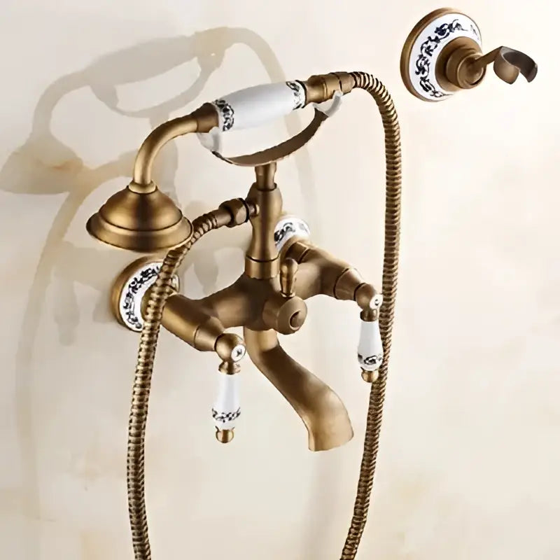 Antique brass bathtub shower set with white ceramic handles and blue floral detailing for decorbites brass bathtub