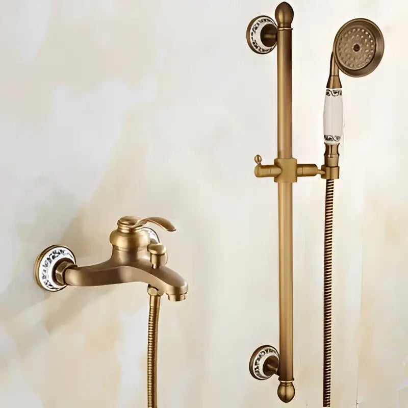 Antique brass bathtub shower set with ceramic handles featuring a brass bathroom faucet with crystal accents and matching rod