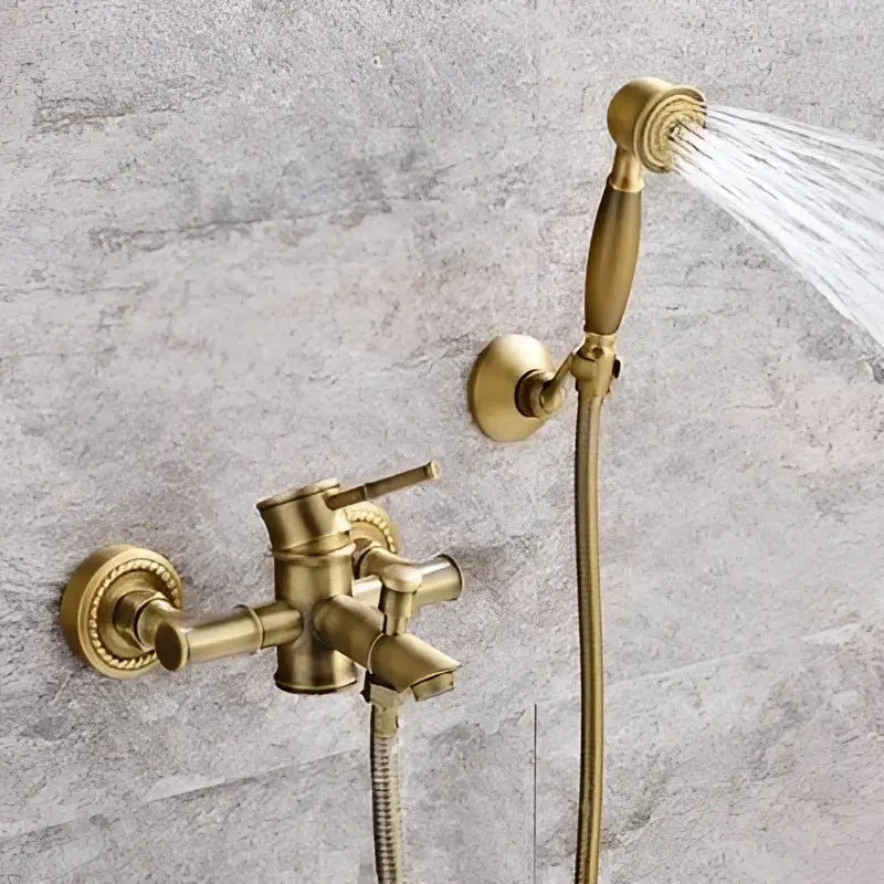 Brass bathtub shower set with ceramic handles and handheld sprayer in antique brass finish by decorbites