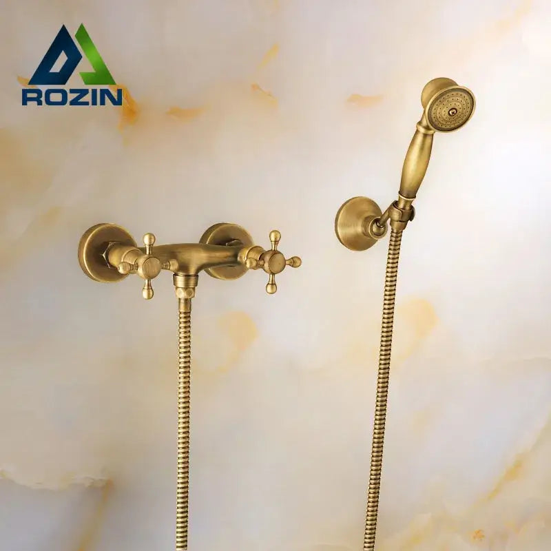 Antique brass bidet mixer faucet set with cross handles and matching handheld showerhead for bathroom use