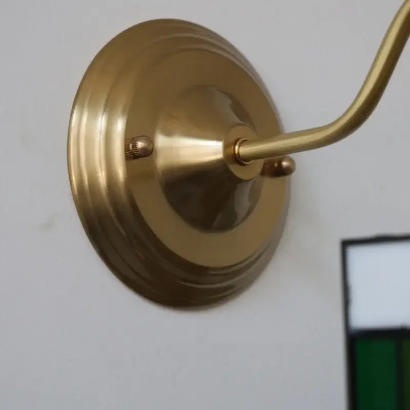 Antique brass wall-mounted sconce with blue flower glass led light and curved arm for bedroom decorbites blue flower lighting