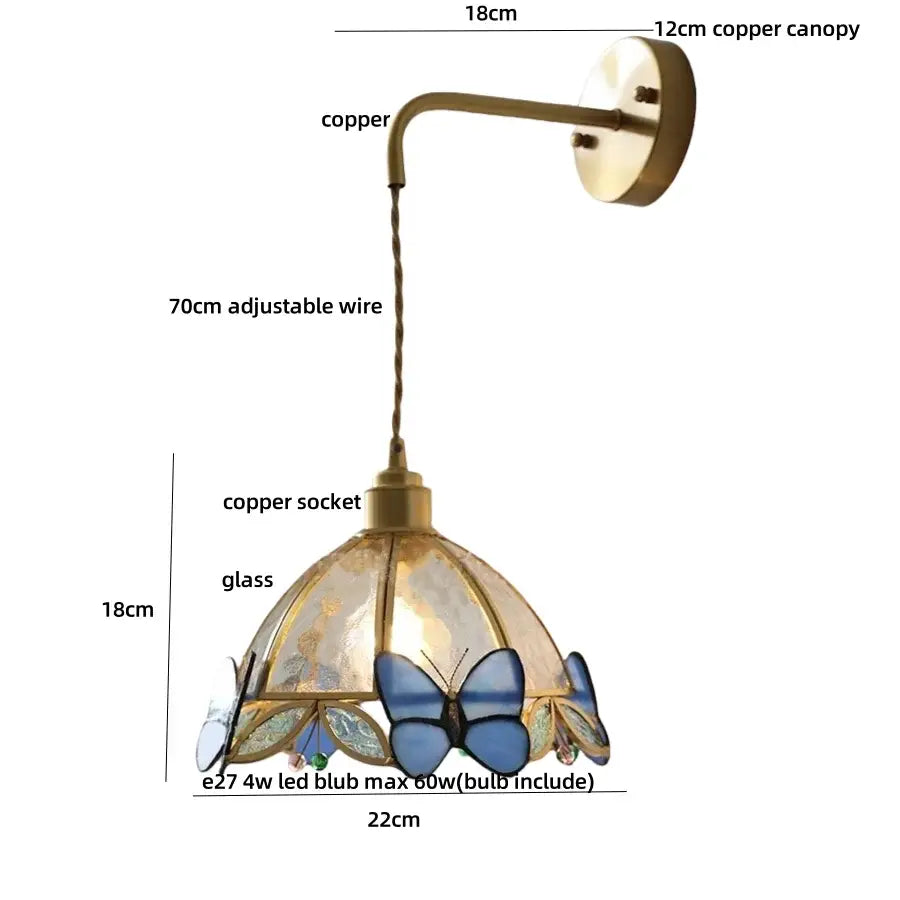 Antique brass wall lights featuring a copper sconce with decorbites butterfly glass led shade in blue floral design