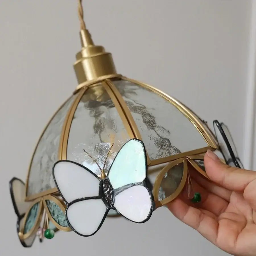 Antique brass butterfly glass led wall lights featuring a delicate white and light blue butterfly pendant on a dome lampshade