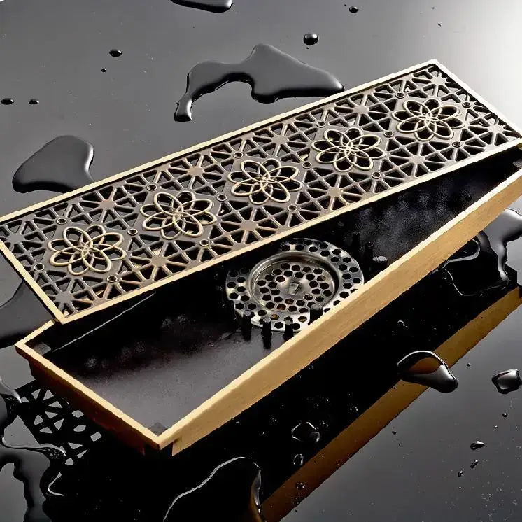 Antique brass floor drain cover with stainless steel hexagonal mesh and black plastic flanges for bathroom drainage