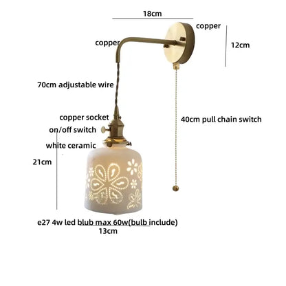 Antique brass ceramic led wall light with copper-finished sconce and white shade featuring floral cutouts and 70cm wire