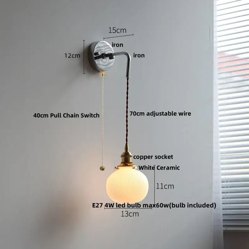 Antique brass ceramic led wall sconce with brushed brass arm copper socket and white ribbed ceramic globe decorbites ceramic led
