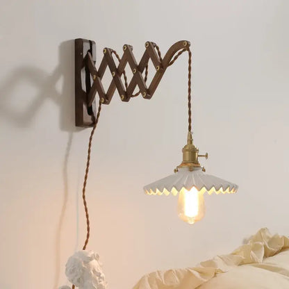 Antique brass ceramic walnut wall sconce with dark brown articulated arm and white scalloped shade for bedroom decorbites ceramic walnut wall