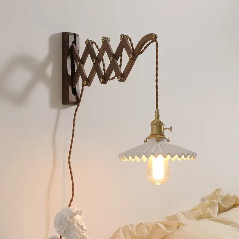 Antique brass ceramic walnut wall sconce with dark brown articulated arm and white scalloped shade for bedroom decorbites ceramic walnut wall