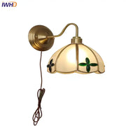 Antique brass glass brass wall sconce with cream shade and green clover motifs for dining room decorbites glass brass