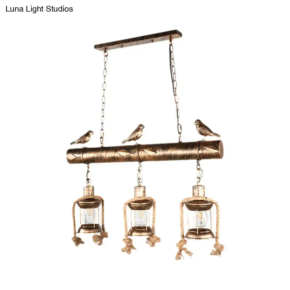 Bronze-finished rustic chandelier with antique brass lanterns, clear glass, carved wood, bird accents, and bulb base suspension