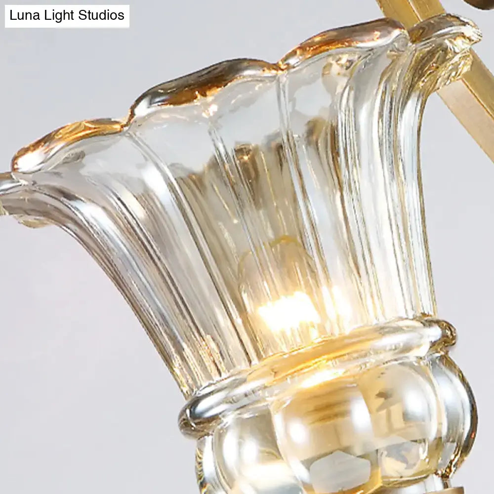 Clear glass chandelier shade with gold-trimmed fluted edges on antique brass crystal drop led bathroom sconce light 110v-120v