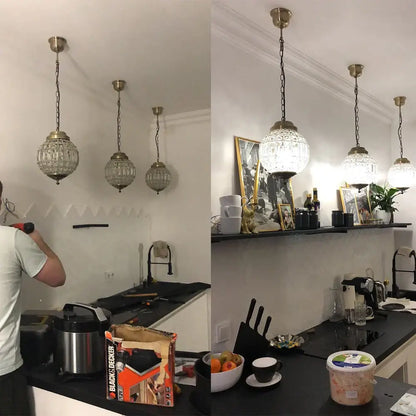 Four vintage-style pendant lights with clear faceted glass globes and brass chains for crystal empire ball chandelier decorbites