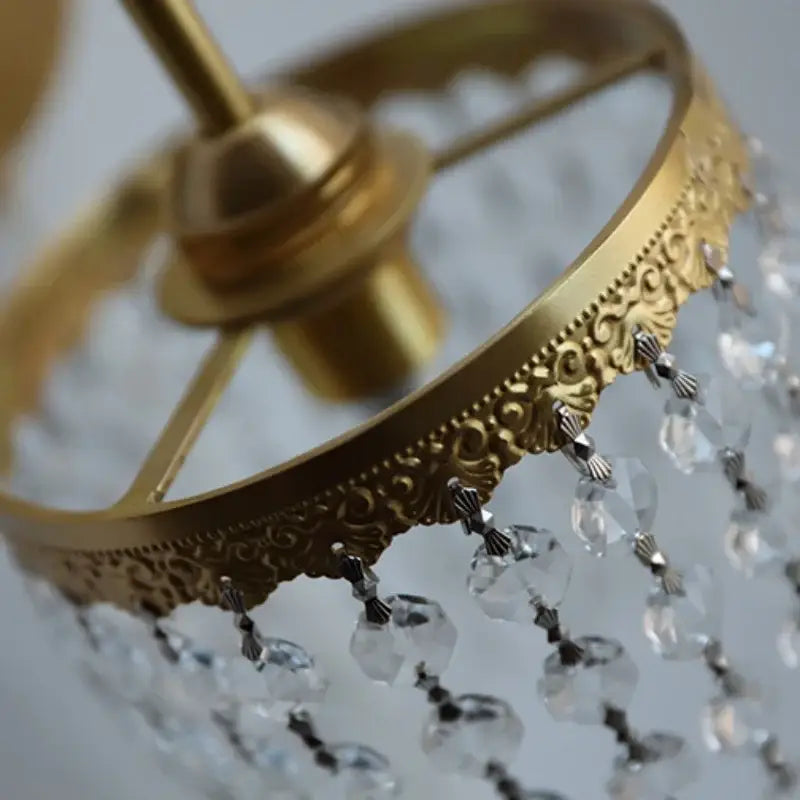 Antique brass wall sconce with gold-toned ornate scrollwork and clear crystal beads for decorbites crystal led wall use